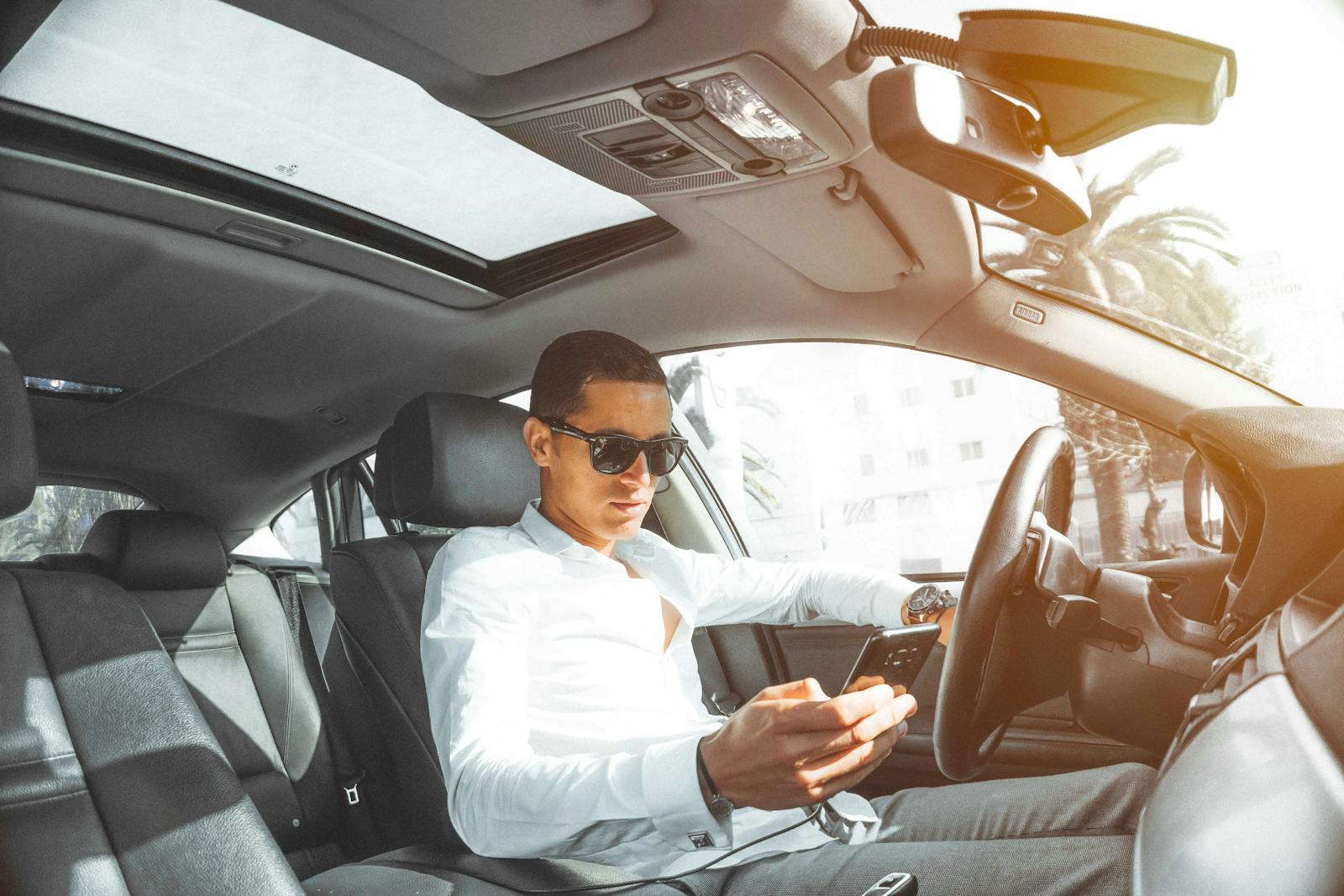 Man in White Dress Shirt Holding Smartphone, auto insurance