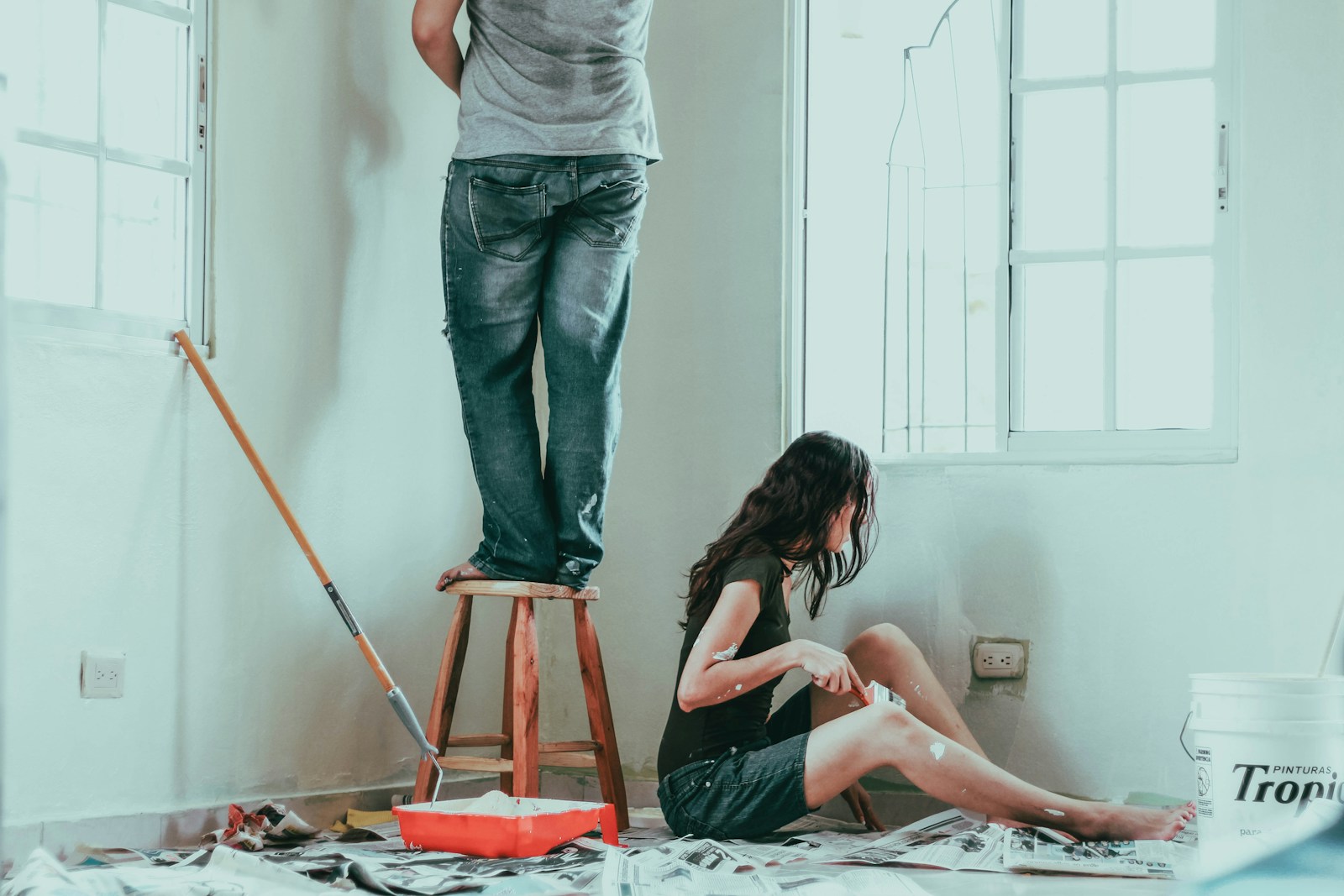 woman in gray tank top and blue denim jeans sitting on bed, home improvements